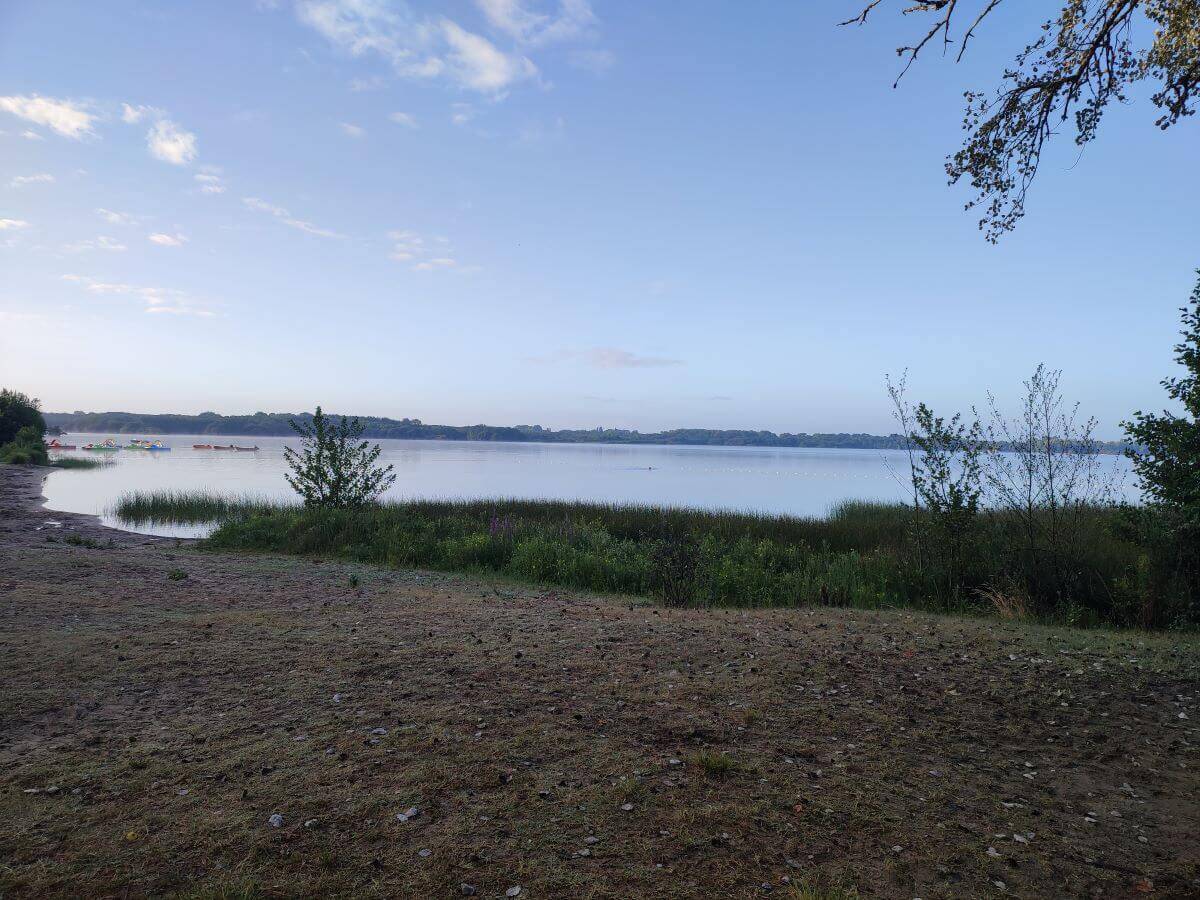 View at dusk over the lake at Le Col Vert Camping in France.