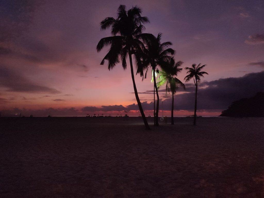Sunset of pink hues on the beach in front of the Shangri-La Rasa Ria hotel in Borneo.