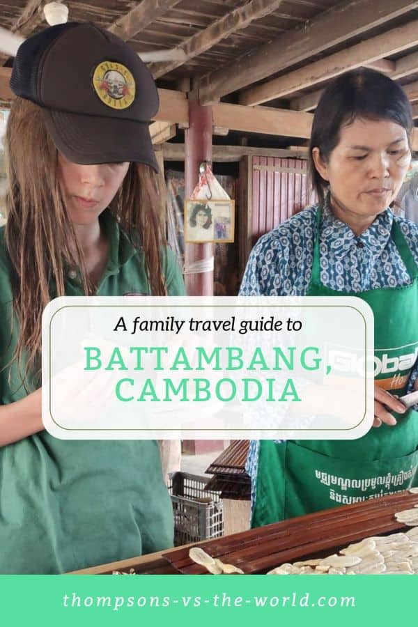 Woman and boy wearing green aprons prepare banana slices for sundrying at a table in Battambang, Cambodia. Text overlay reads "A family travel guide to BATTAMBANG, CAMBODIA" in green and white. Perfect for families planning a trip to Battambang with kids! Save this pin to your Pinterest board for later reference.