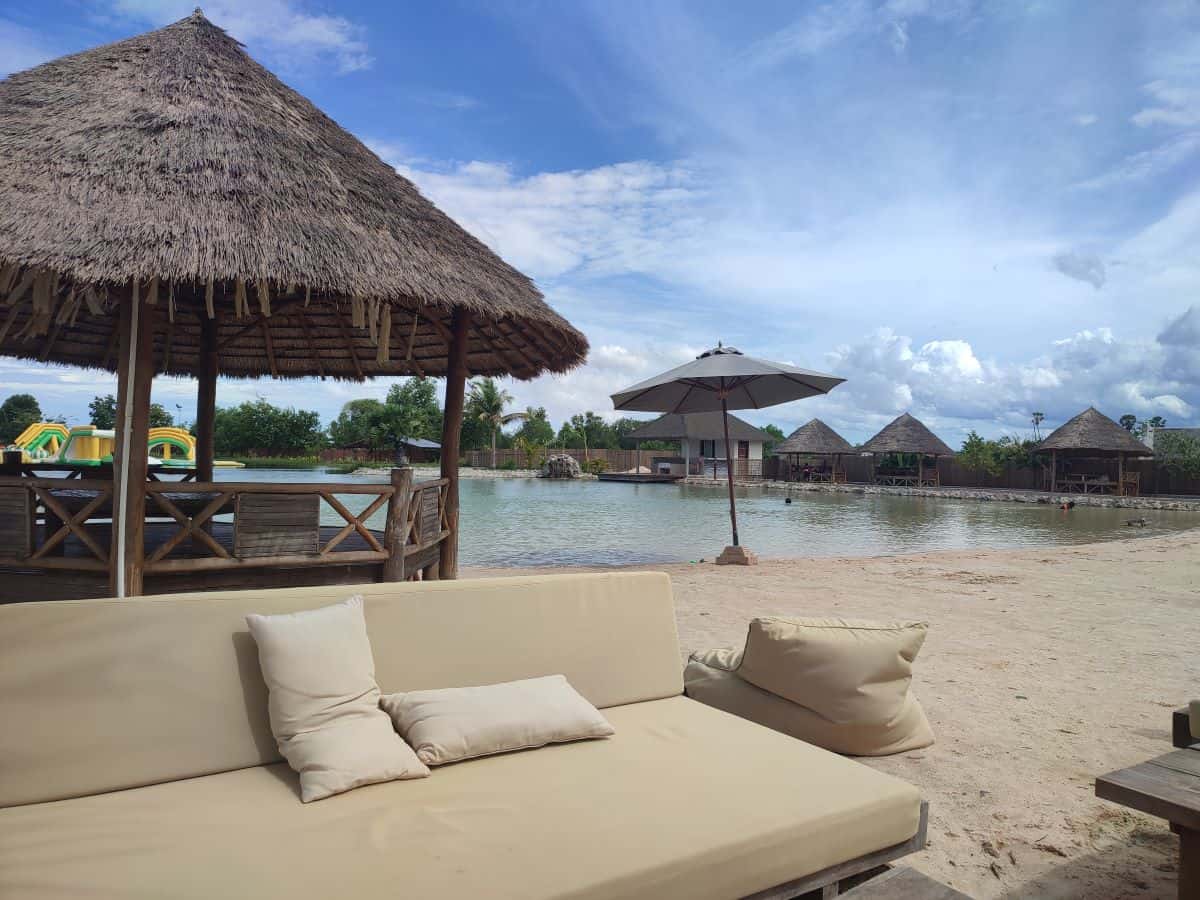 View of a sofa on a beach by the lake at Cambodia Wake Park in Siem Reap.